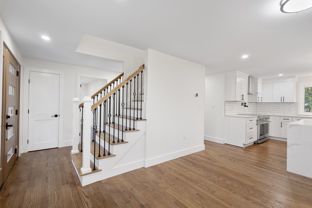 241 Prospect Street Franklin, MA 02038 - Photo 10 of 42 a view of a kitchen with wooden floor and electronic appliances