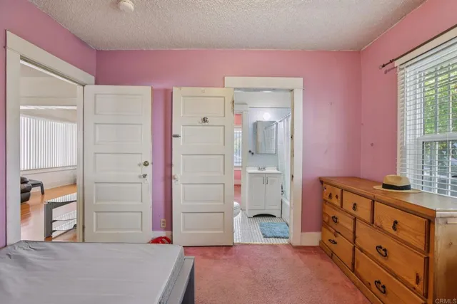 view of hall way with mirror and window