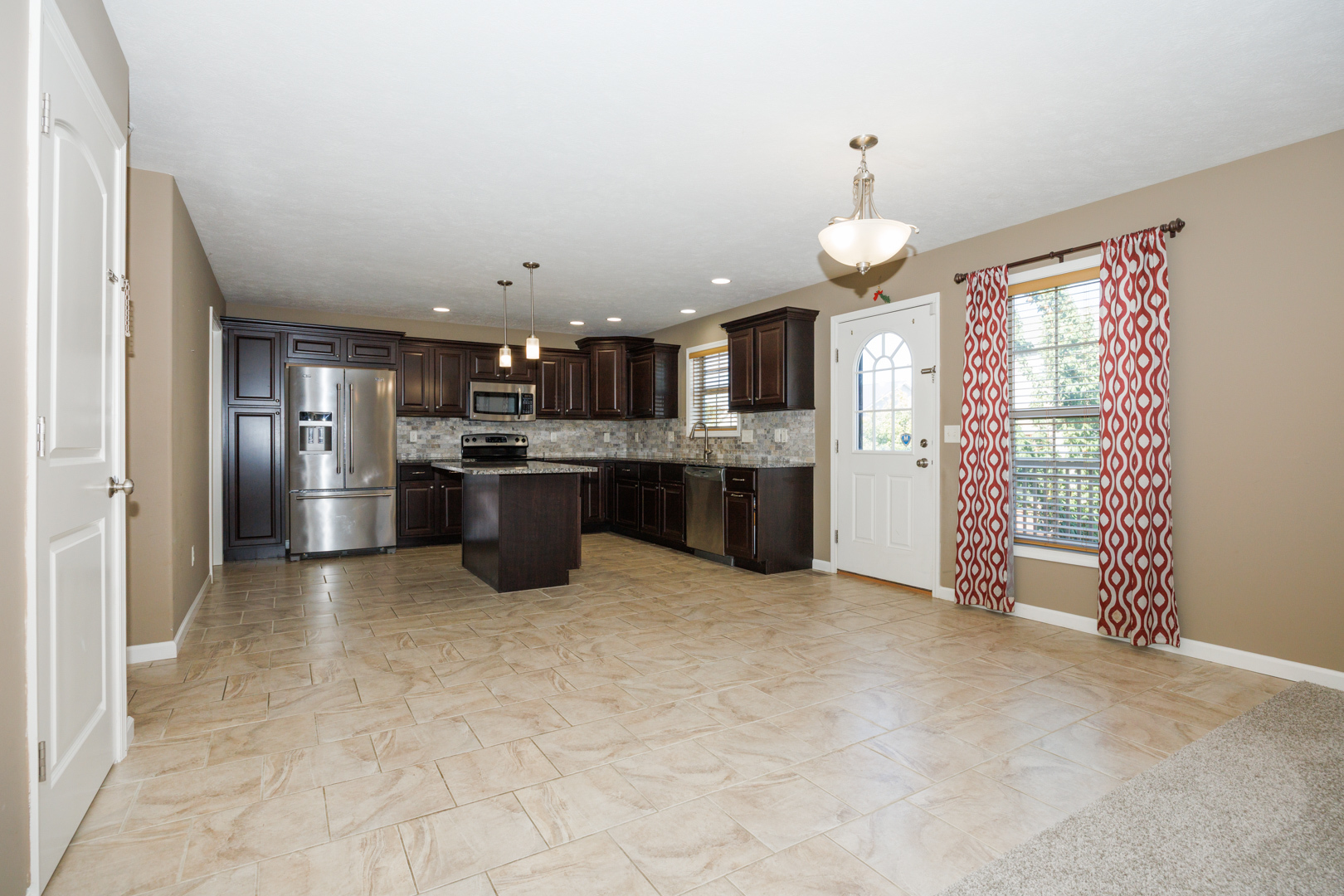 1714 Flagstone Drive Normal, IL 61761 - Photo 19 of 61 a open kitchen with cabinets and stainless steel appliances
