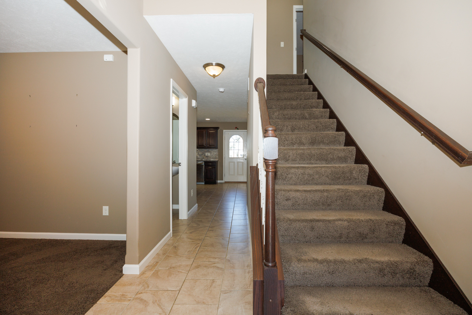 1714 Flagstone Drive Normal, IL 61761 - Photo 3 of 61 a view of entryway and hall with wooden floor