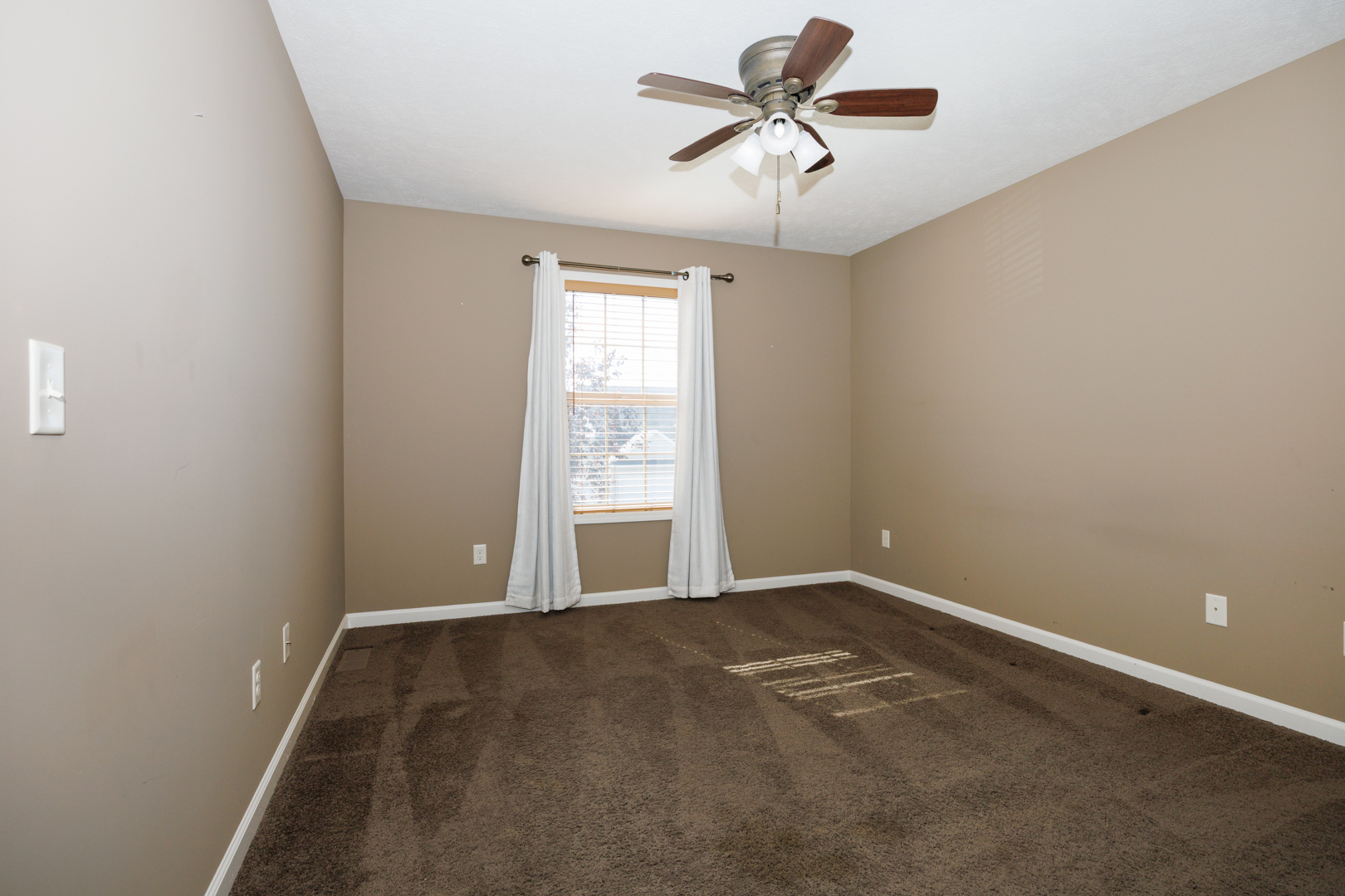 1714 Flagstone Drive Normal, IL 61761 - Photo 32 of 61 an empty room with windows and fan