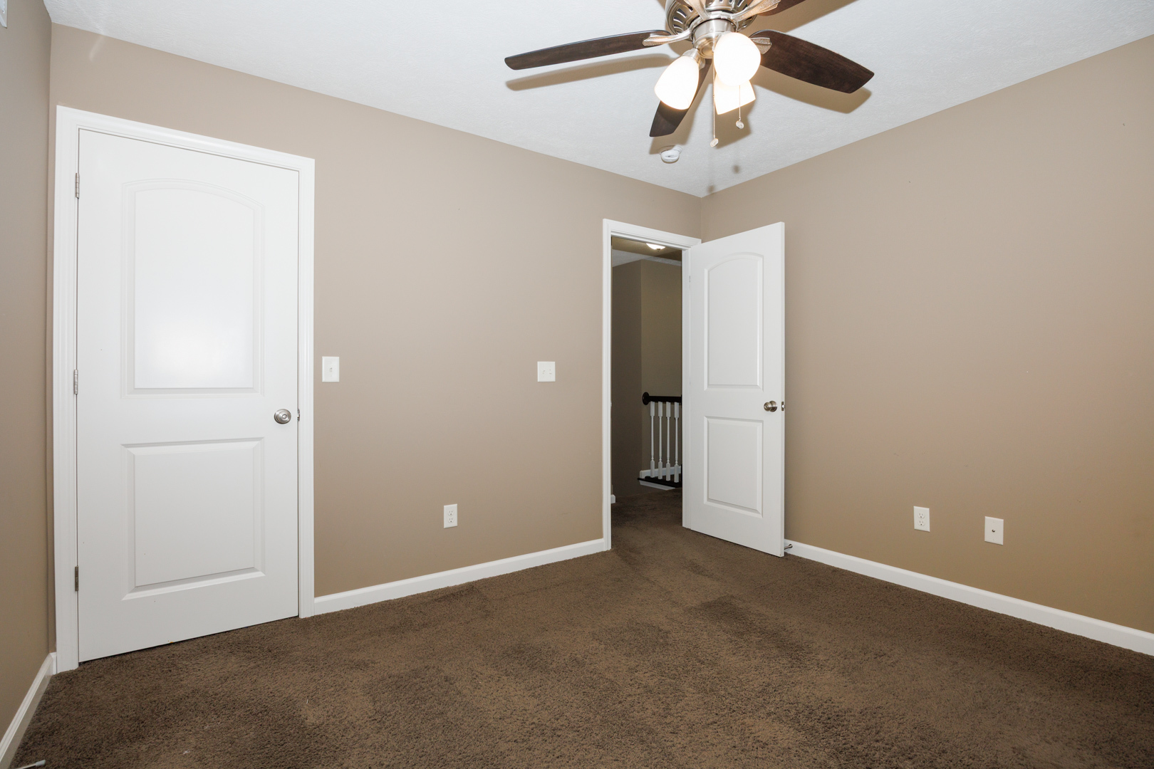 1714 Flagstone Drive Normal, IL 61761 - Photo 36 of 61 an empty room with closet and a chandelier fan
