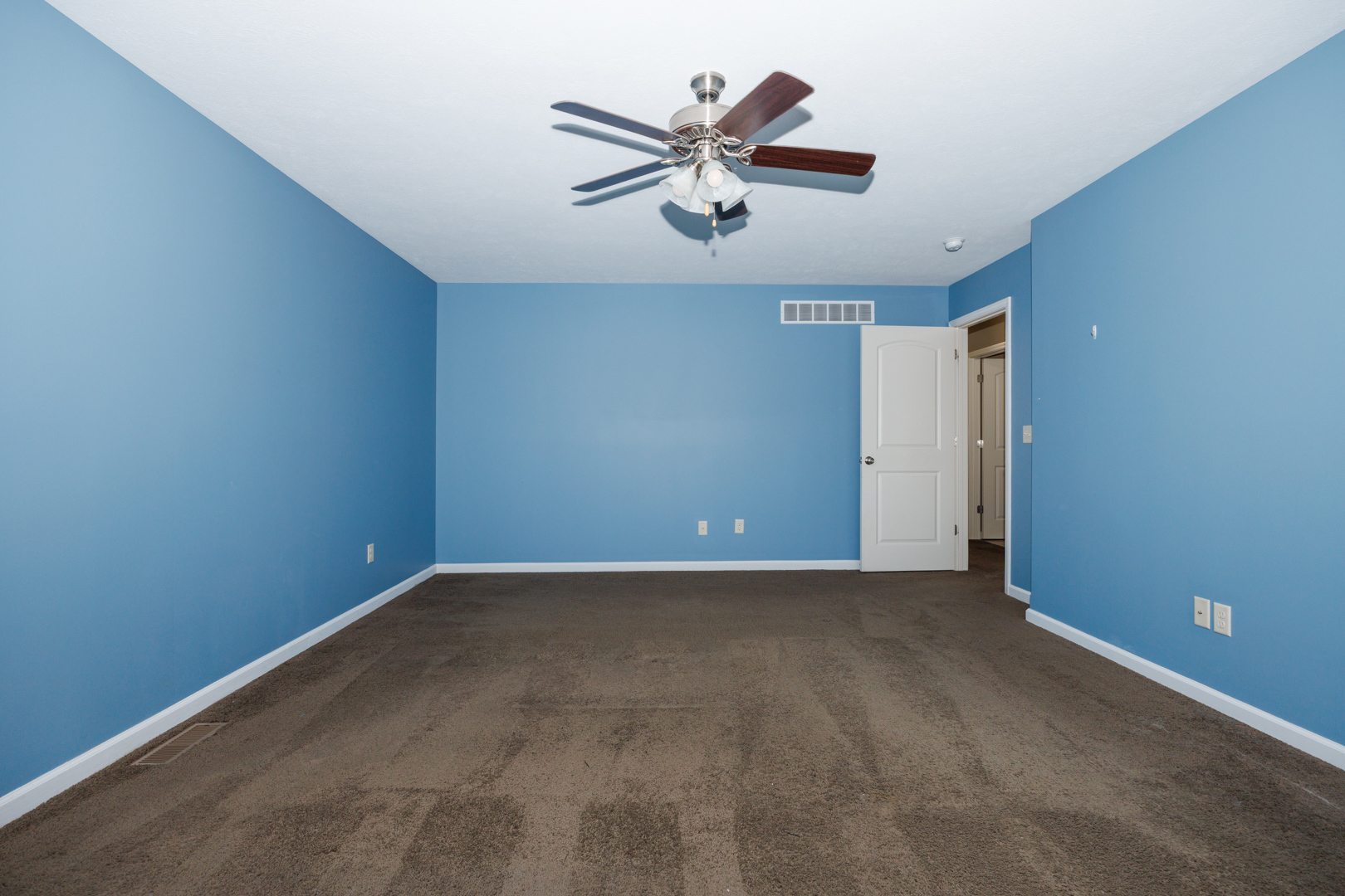 1714 Flagstone Drive Normal, IL 61761 - Photo 40 of 61 an empty room with closet and ceiling fan