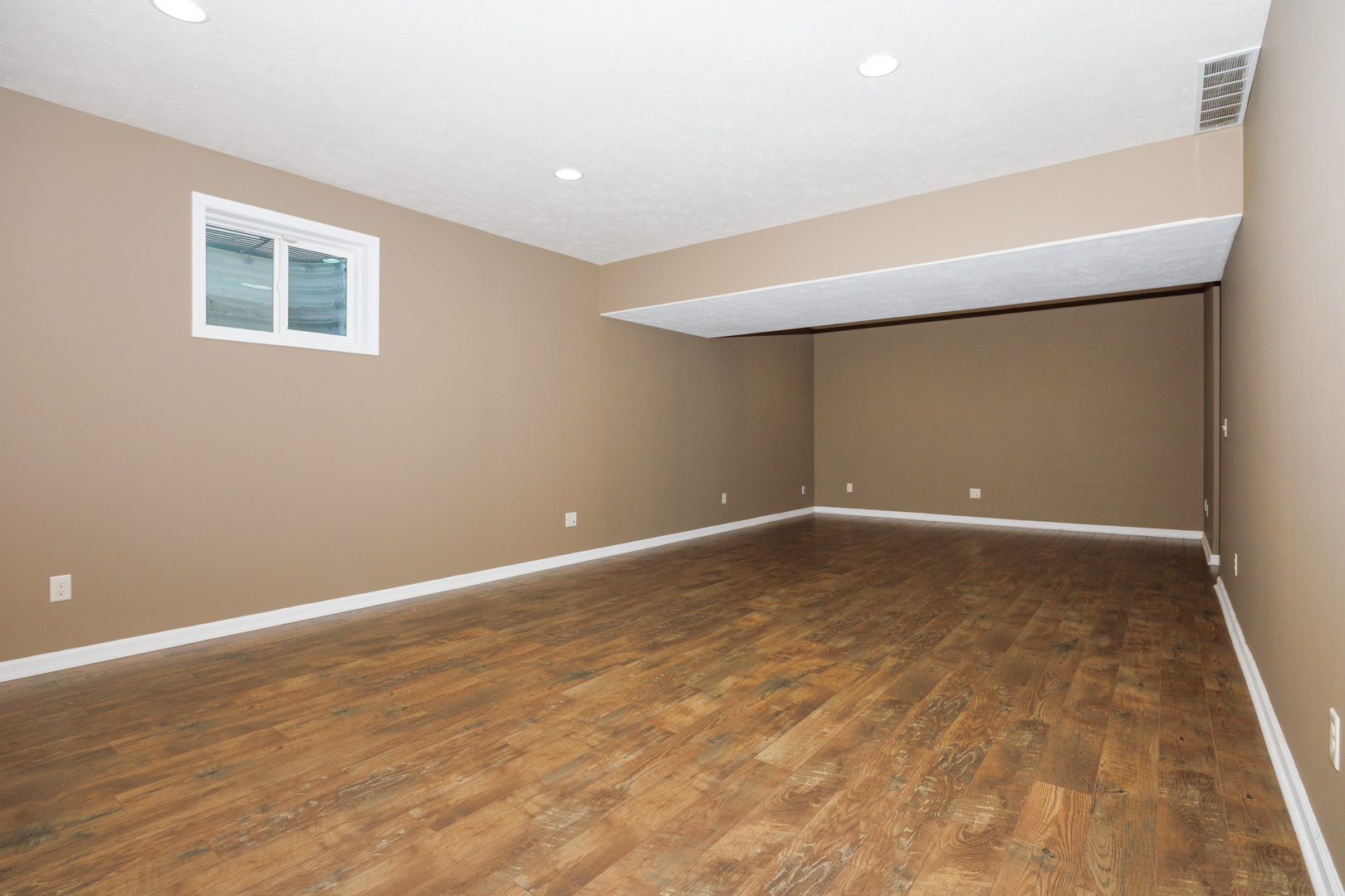 1714 Flagstone Drive Normal, IL 61761 - Photo 45 of 61 a view of an empty room with wooden floor and a window
