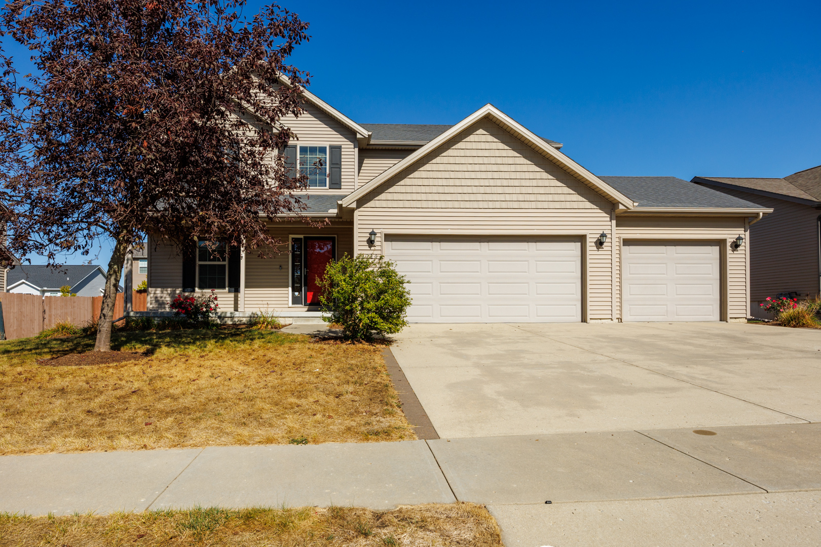 1714 Flagstone Drive Normal, IL 61761 - Photo 61 of 61 a front view of a house with a yard