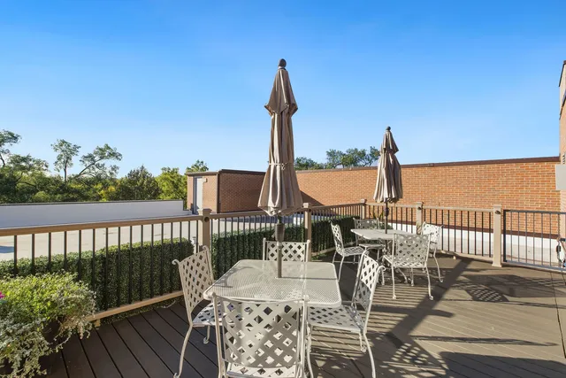 a view of a balcony with furniture