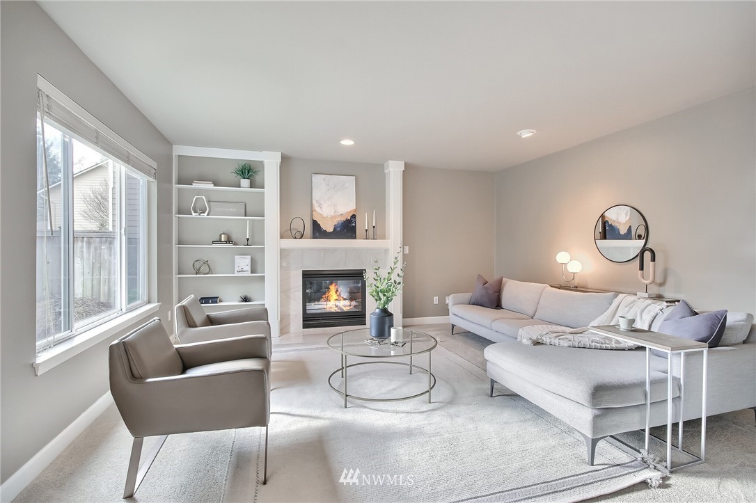 4405 Northeast 7th Street Renton, WA 98059 - Photo 14 of 27 a living room with furniture and a fireplace