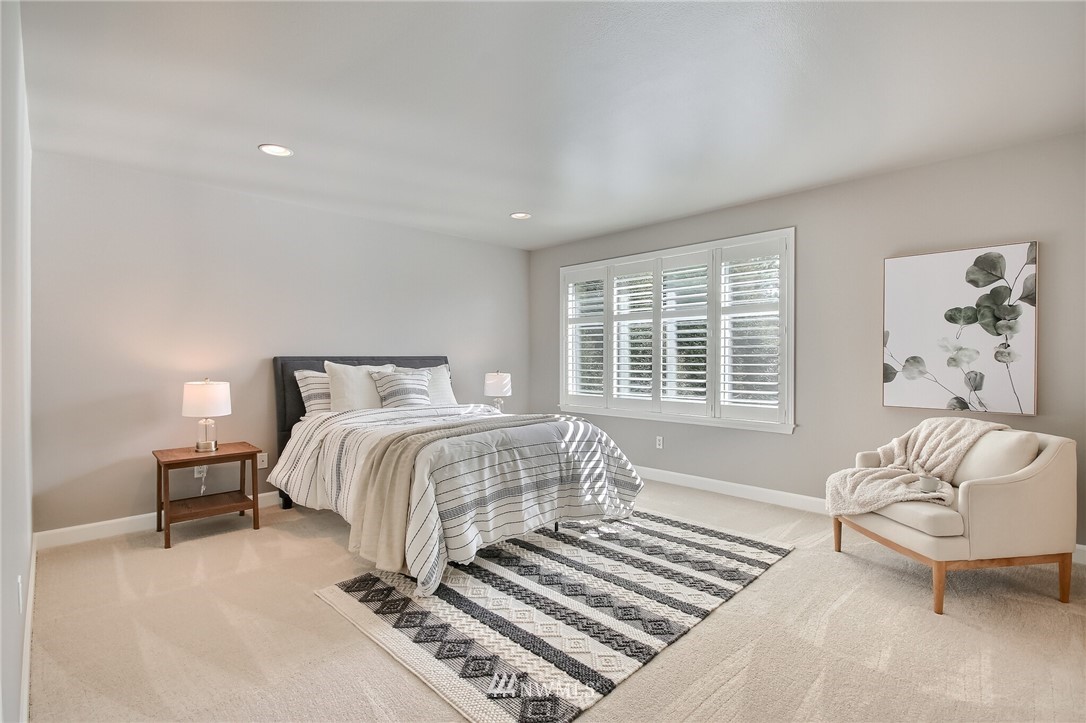 4405 Northeast 7th Street Renton, WA 98059 - Photo 18 of 27 a bedroom with a bed and a couch