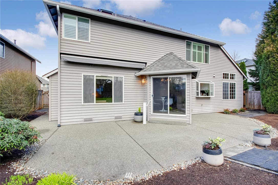 4405 Northeast 7th Street Renton, WA 98059 - Photo 24 of 27 a view of a house with a small yard and a large window
