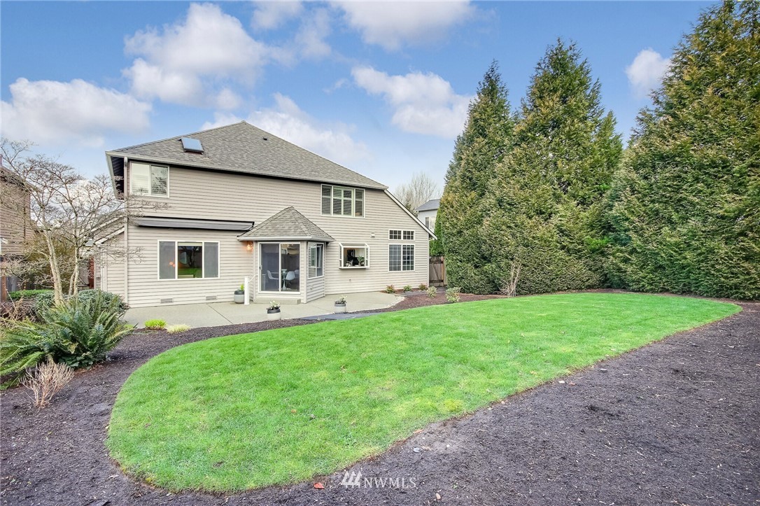 4405 Northeast 7th Street Renton, WA 98059 - Photo 27 of 27 a front view of a house with garden