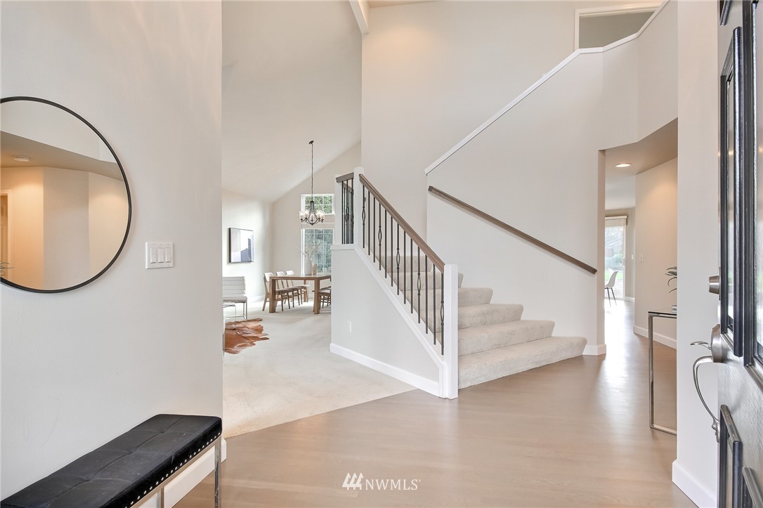 4405 Northeast 7th Street Renton, WA 98059 - Photo 5 of 27 a view of a livingroom with wooden floor and entryway