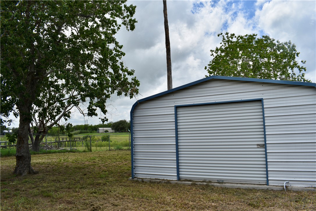 25051 Lake Shore Drive Mathis, TX 78368 - Photo 40 of 40 a backyard of a house with lots of green space