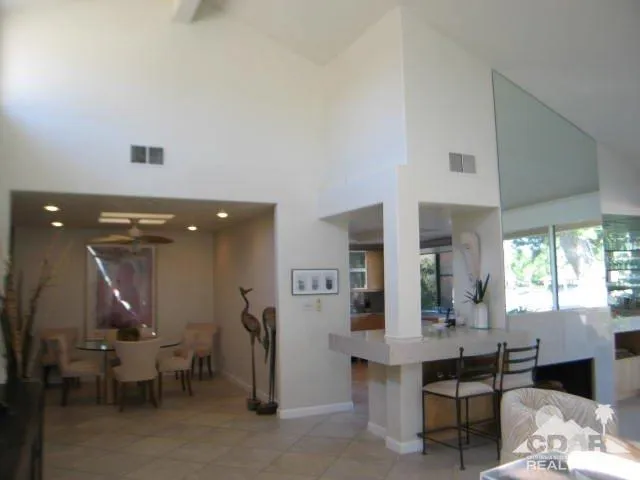 a kitchen with a refrigerator a stove and cabinets
