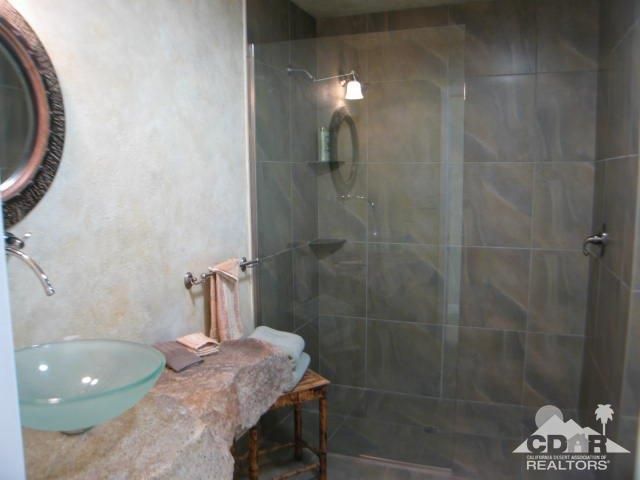 a bathroom with a double vanity sink and a mirror