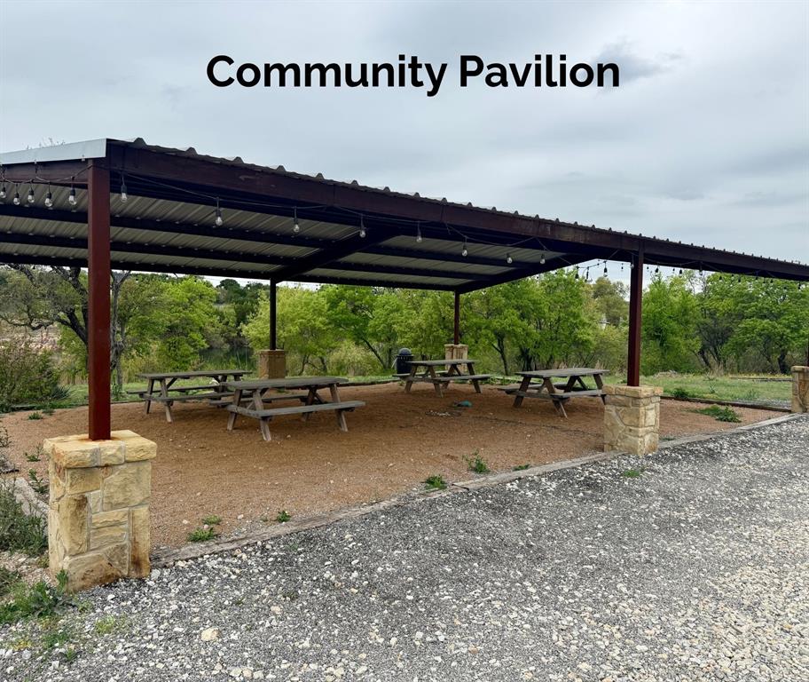 1059 Sweeney Way Weatherford, TX 76087 - Photo 36 of 37 a view of a patio with table and chairs under an umbrella