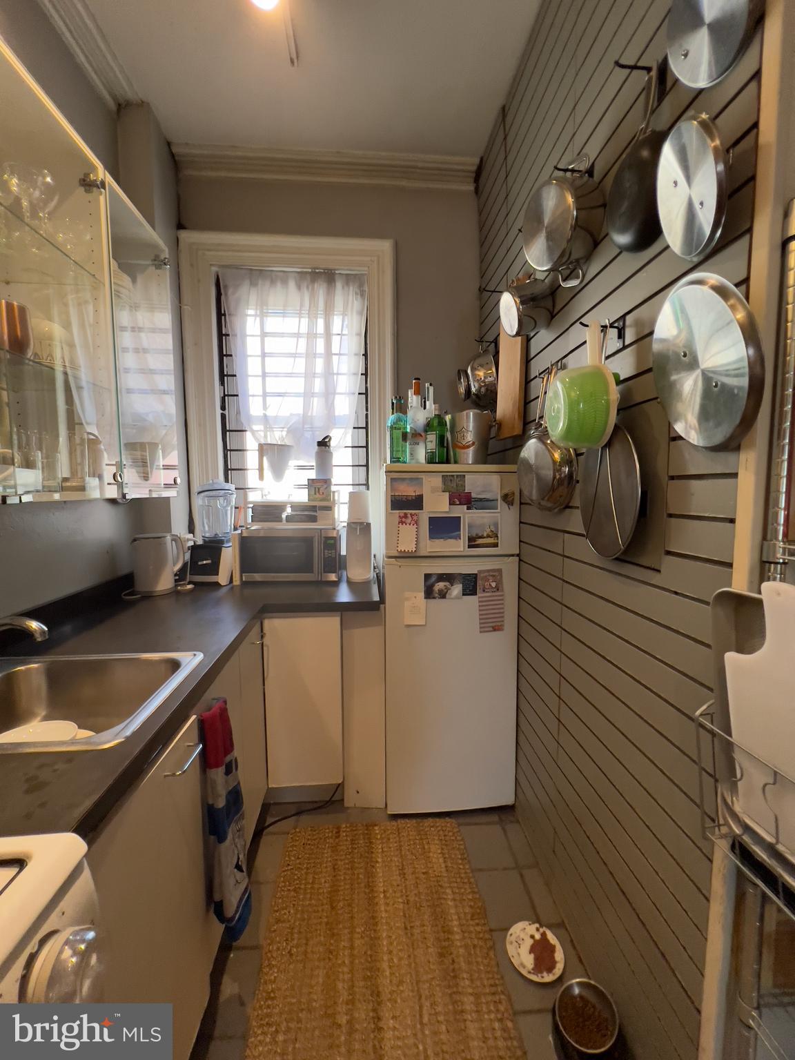 257 South 20th Street, Unit 2F Philadelphia, PA 19103 - Photo 11 of 29 a kitchen with a sink and cabinets