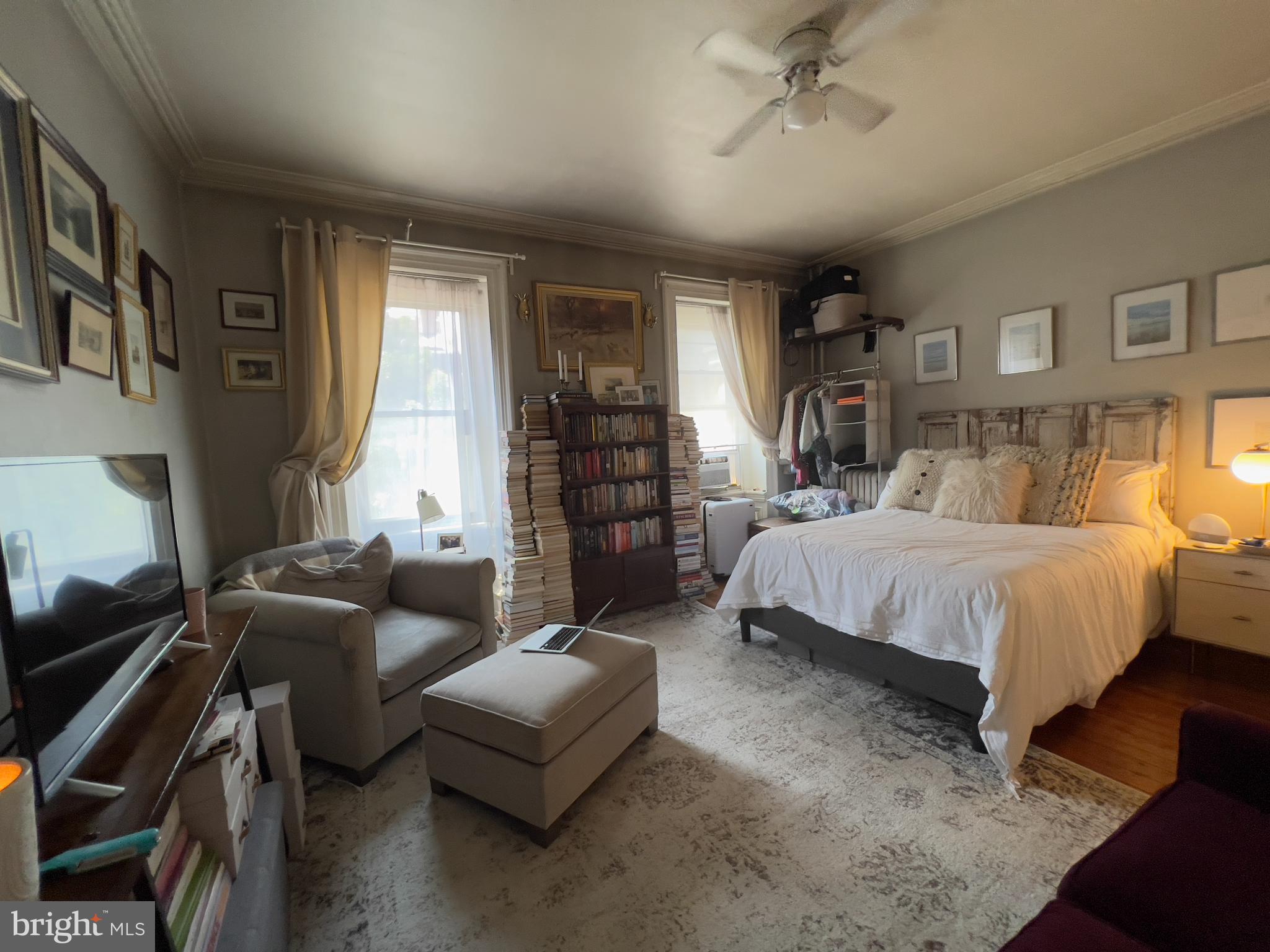 257 South 20th Street, Unit 2F Philadelphia, PA 19103 - Photo 16 of 29 a bedroom with bed couch and window