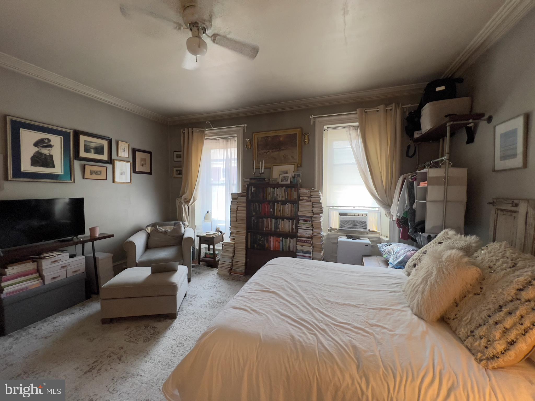 257 South 20th Street, Unit 2F Philadelphia, PA 19103 - Photo 18 of 29 a bedroom with a bed couch and a window