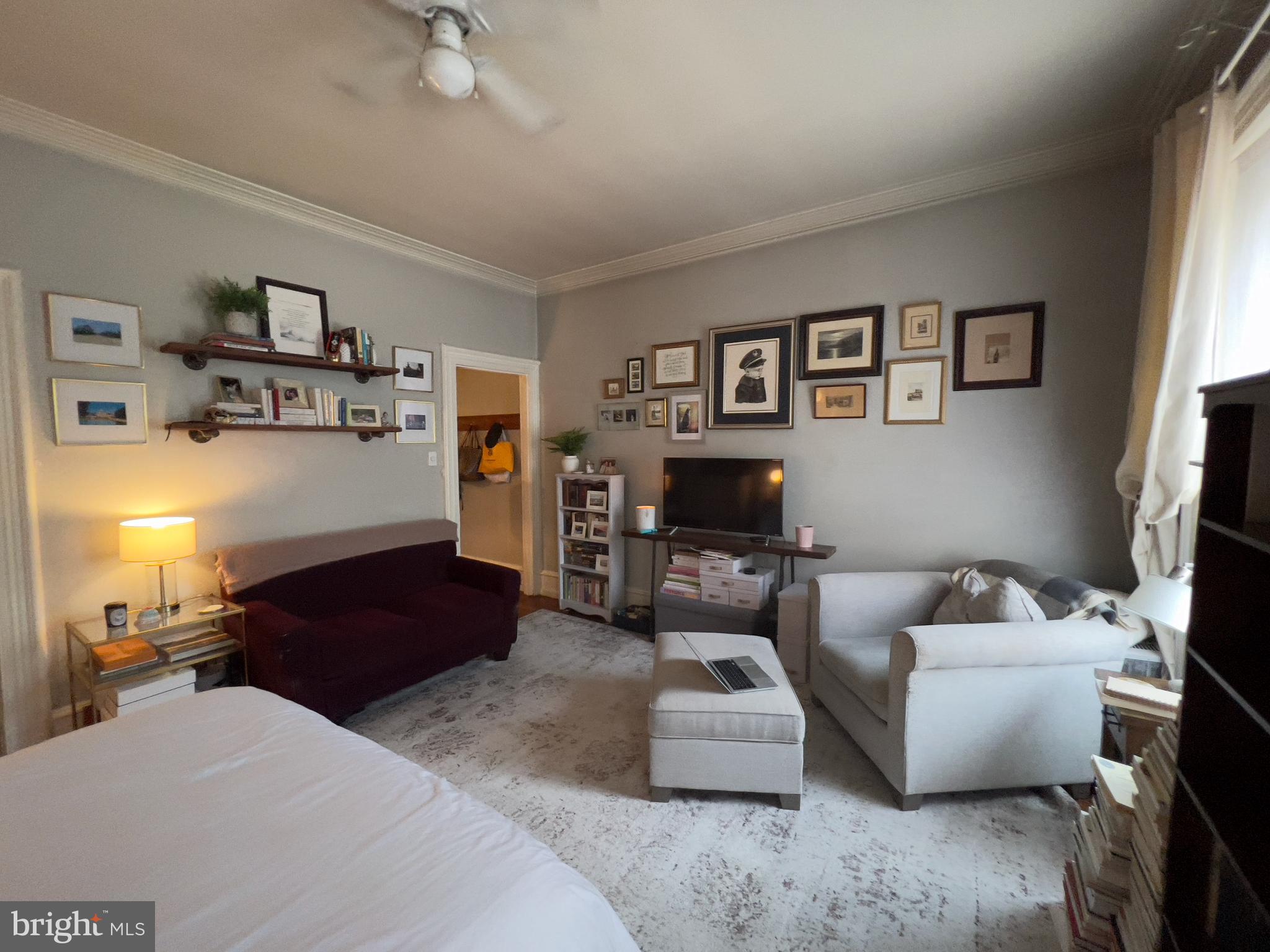 257 South 20th Street, Unit 2F Philadelphia, PA 19103 - Photo 20 of 29 a living room with furniture and a flat screen tv