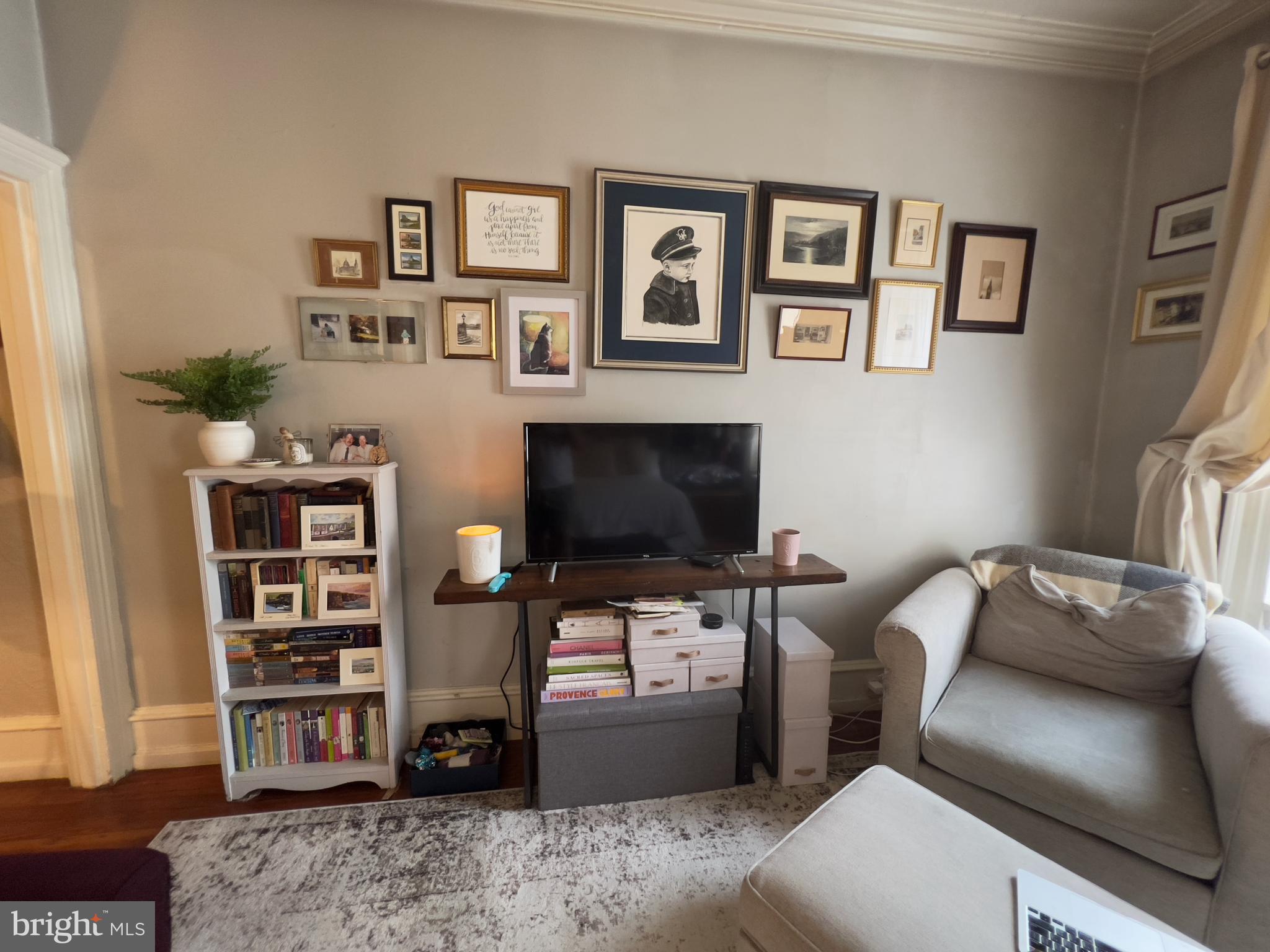 257 South 20th Street, Unit 2F Philadelphia, PA 19103 - Photo 22 of 29 a living room with furniture and a flat screen tv