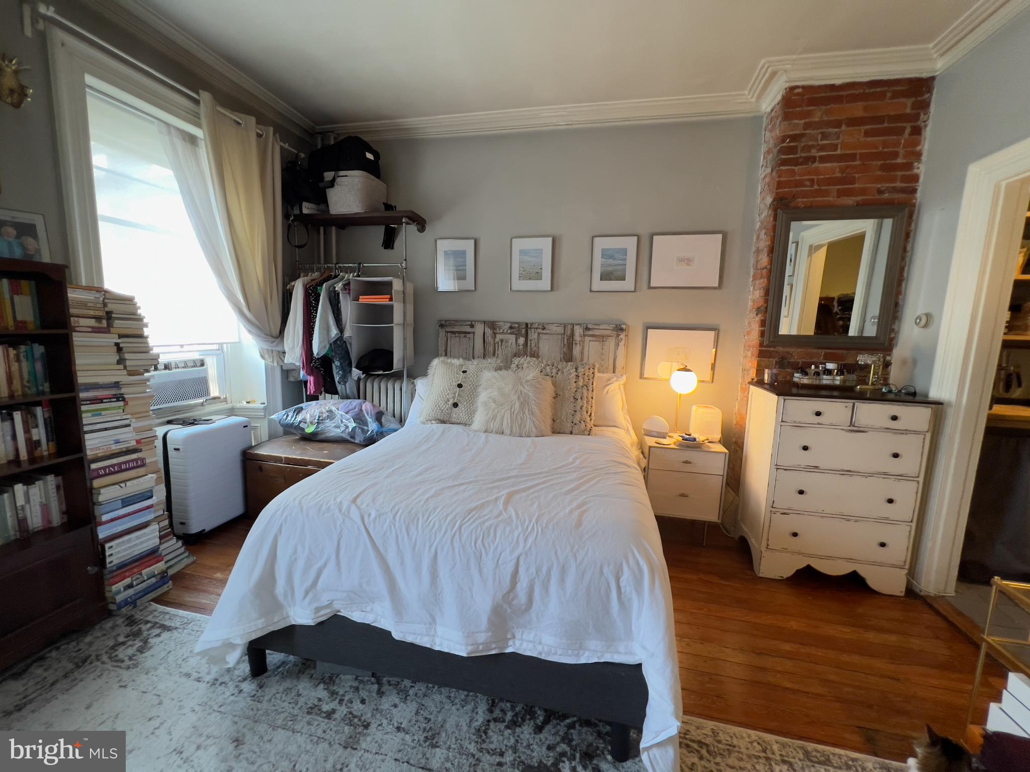 257 South 20th Street, Unit 2F Philadelphia, PA 19103 - Photo 24 of 29 a bed room with a bed and a television
