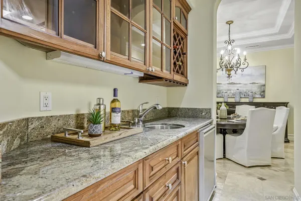 a kitchen with stainless steel appliances granite countertop a sink and cabinets