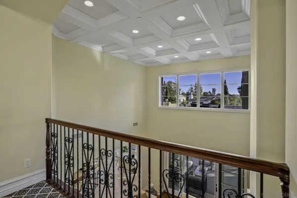 a view of a hallway with furniture