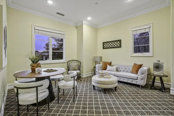 a living room with furniture and a table