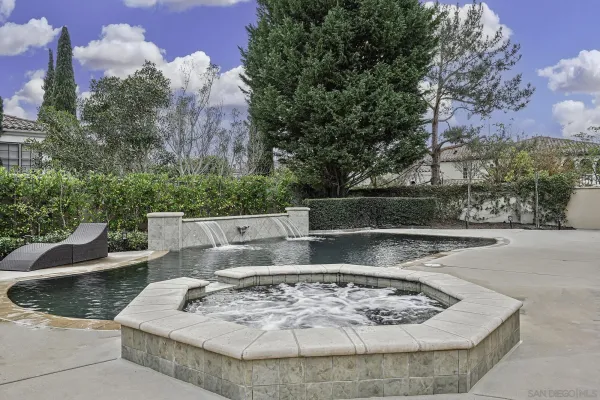 a view of a swimming pool with a patio