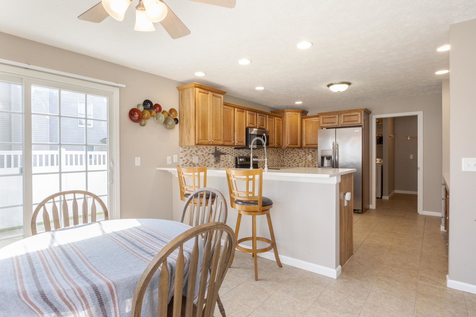 3276 Fire Fly Court Normal, IL 61761 - Photo 20 of 52 a kitchen with a table chairs refrigerator and a window