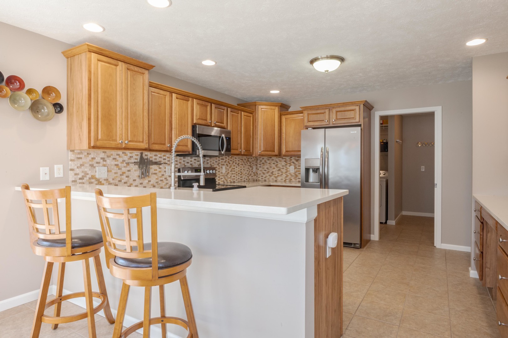 3276 Fire Fly Court Normal, IL 61761 - Photo 21 of 52 a kitchen with a refrigerator and a stove top oven