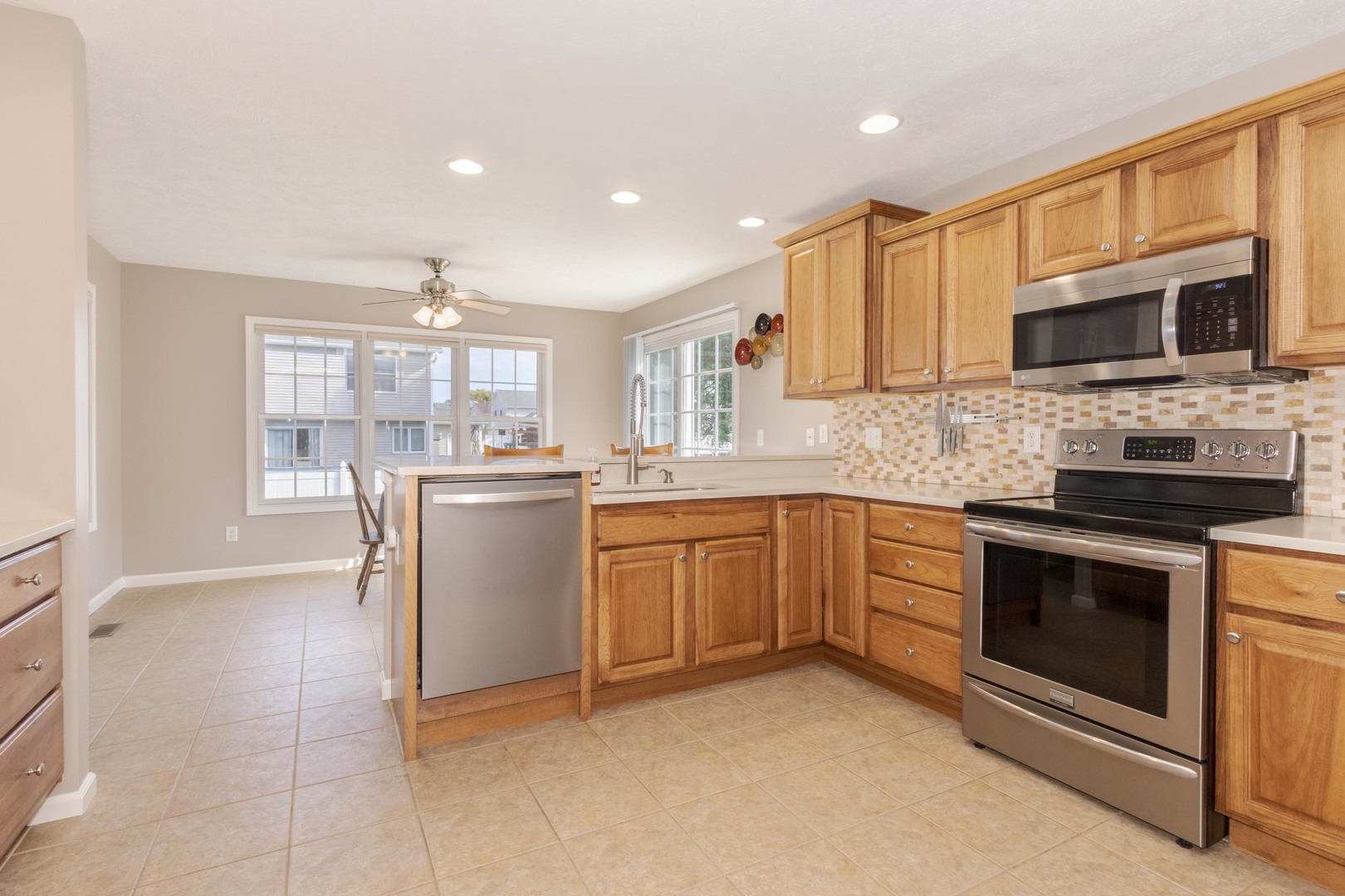 3276 Fire Fly Court Normal, IL 61761 - Photo 24 of 52 a kitchen with a sink stove and microwave