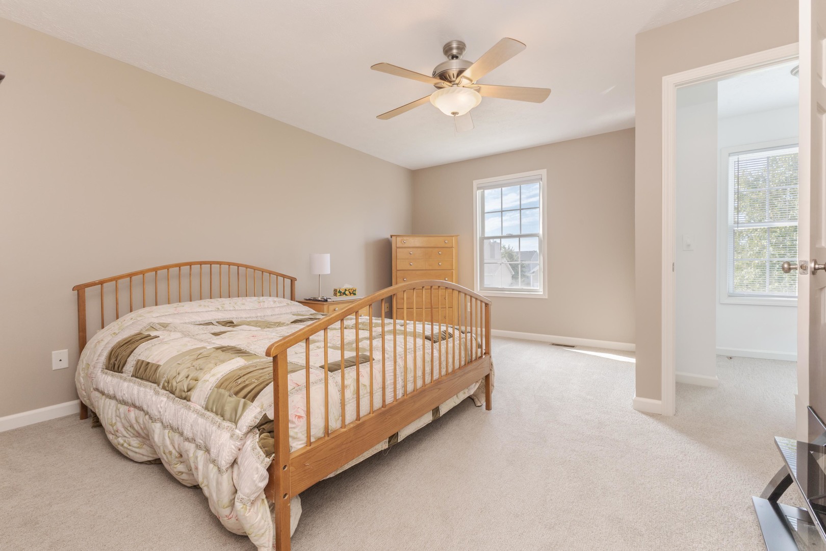 3276 Fire Fly Court Normal, IL 61761 - Photo 31 of 52 a spacious bedroom with a bed and a window