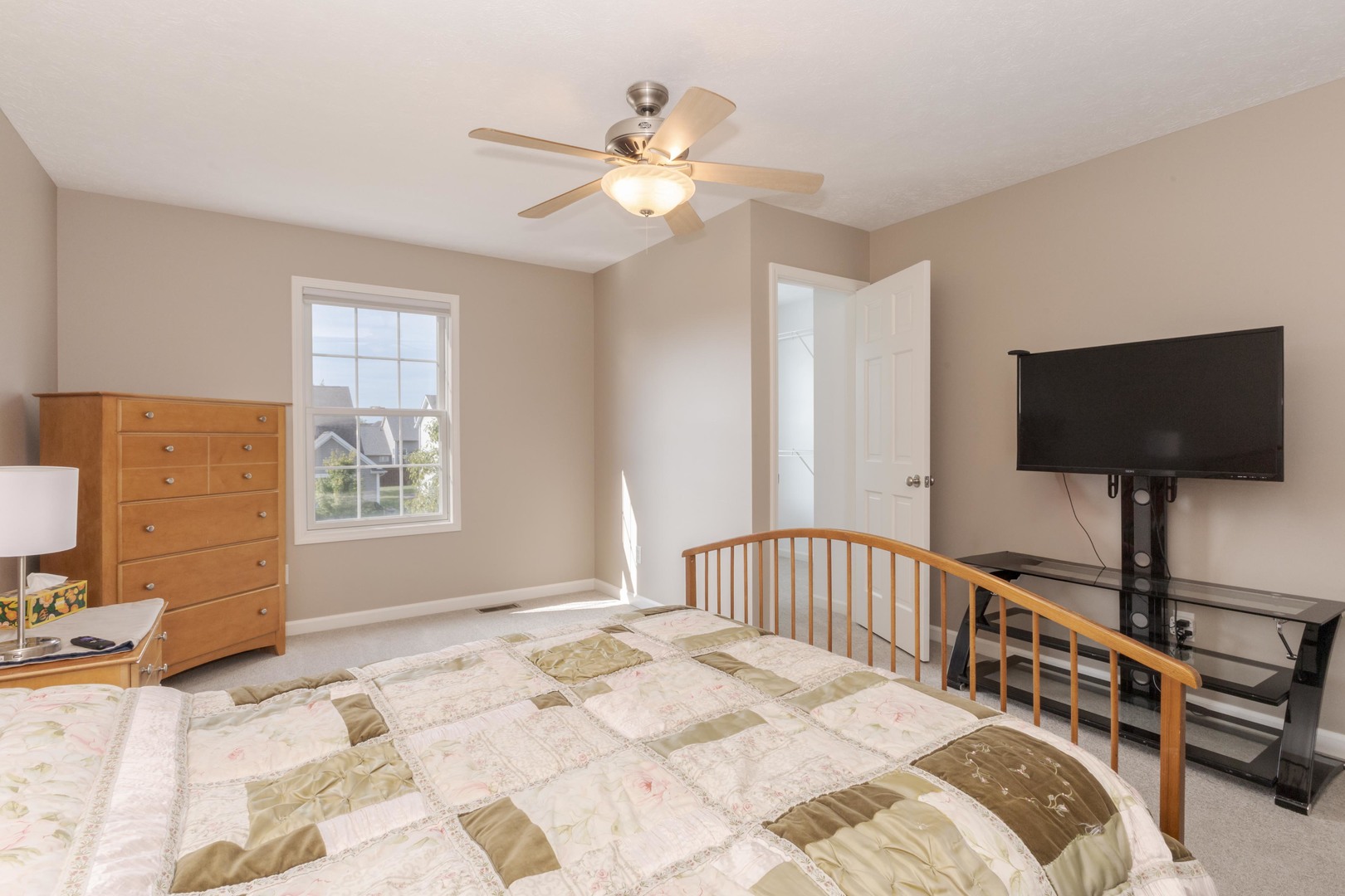 3276 Fire Fly Court Normal, IL 61761 - Photo 32 of 52 a bedroom with a bed and a flat screen tv