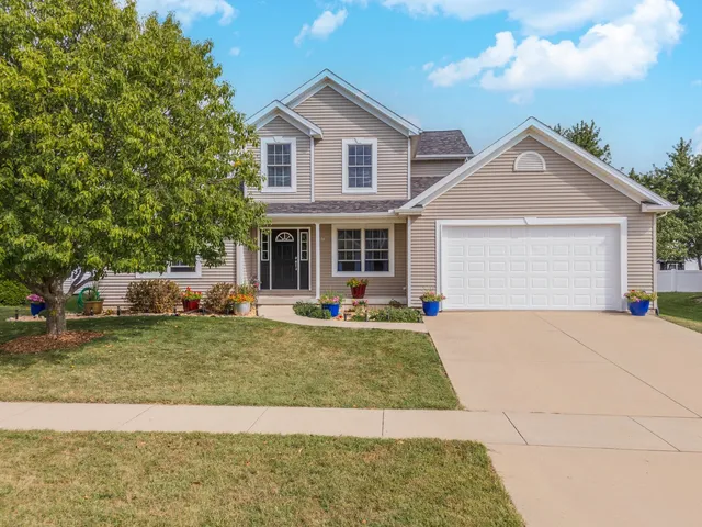 a view of a house with a yard patio and swimming pool