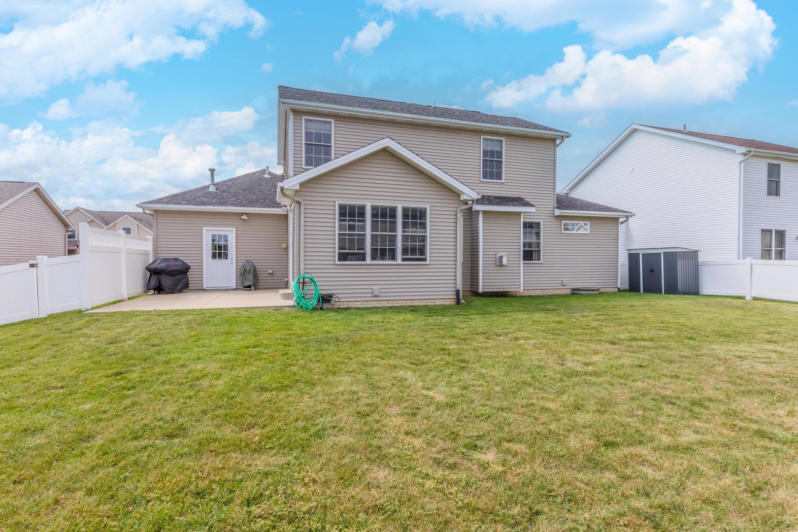 3276 Fire Fly Court Normal, IL 61761 - Photo 49 of 52 a view of a house with a small yard and large tree