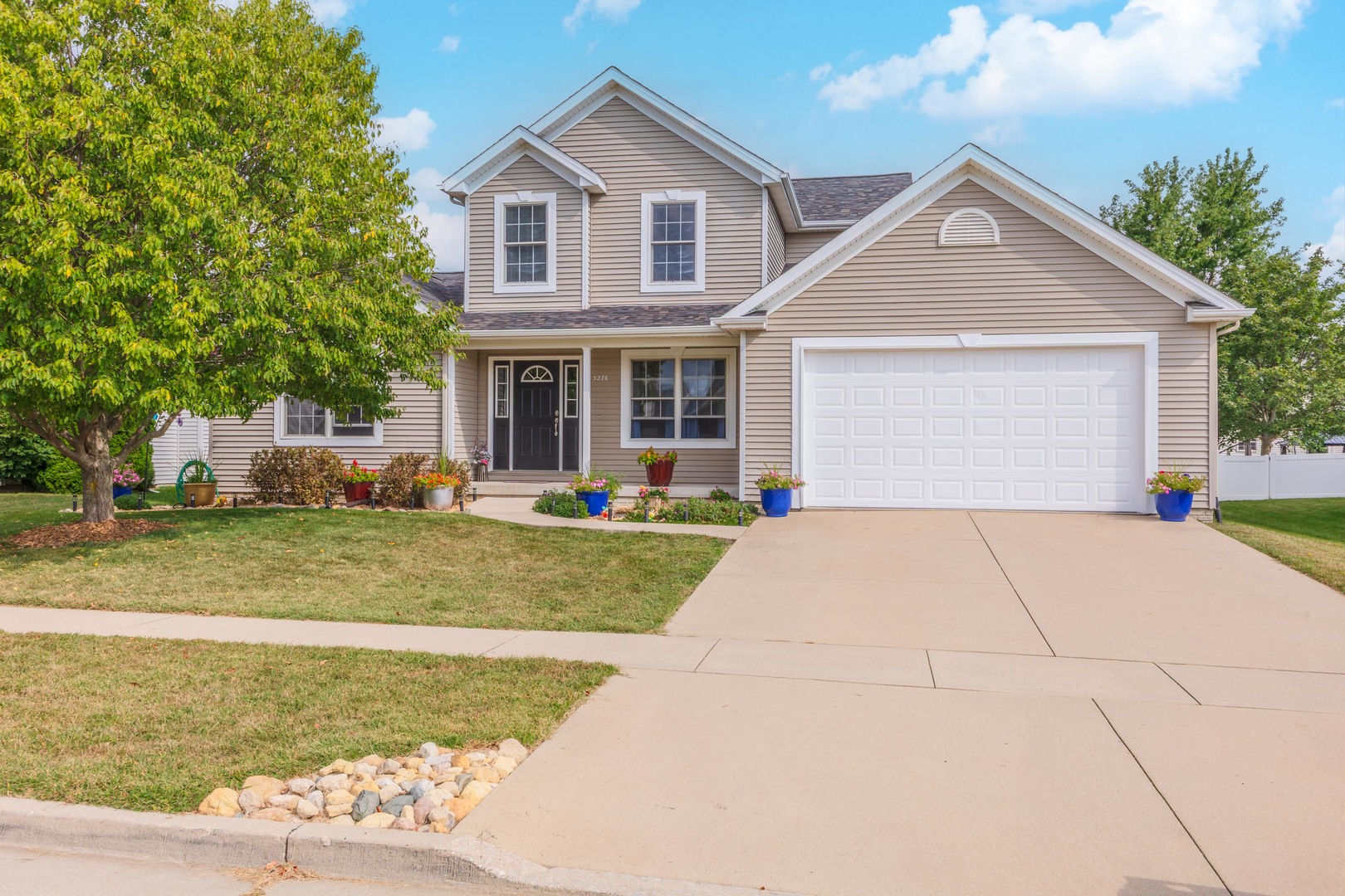 3276 Fire Fly Court Normal, IL 61761 - Photo 52 of 52 a front view of a house with a yard and garage
