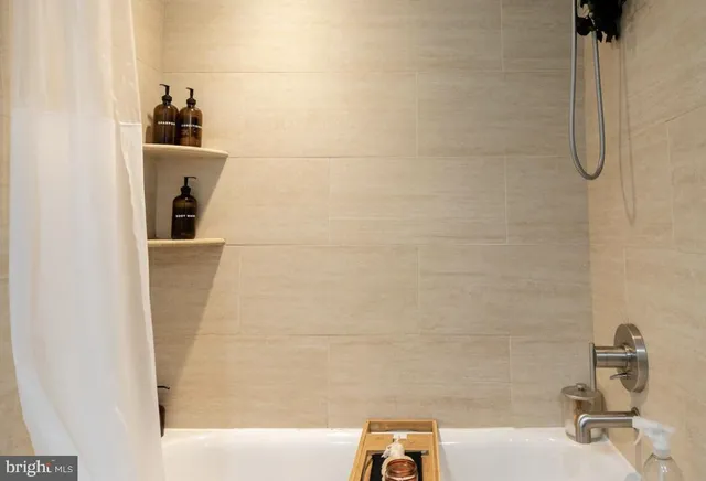 a bedroom with a large bed and a large window