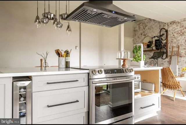 a kitchen with a stove and a sink