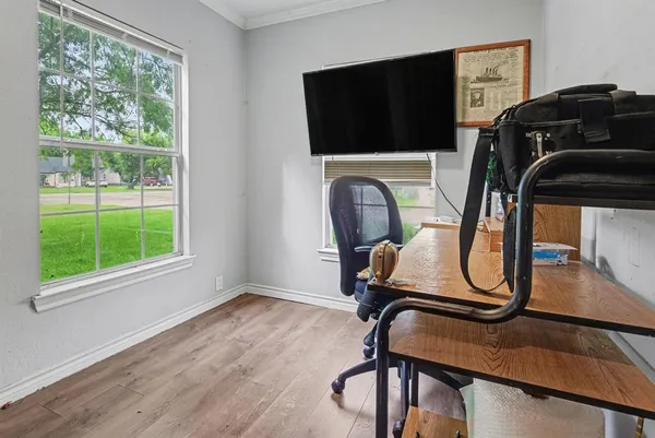 a room with gym equipment and windows