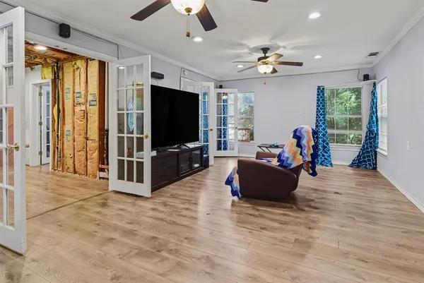 a living room with furniture and a flat screen tv