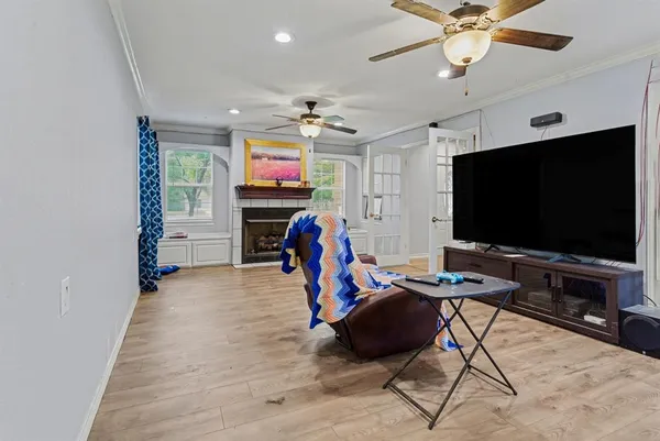 a living room with furniture and a flat screen tv