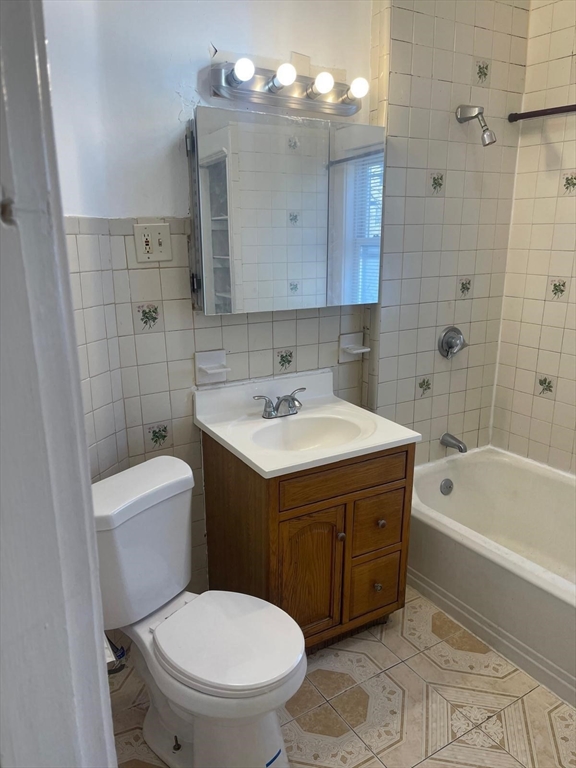 39 Magnolia Street, Unit 2 Malden, MA 02148 - Photo 2 of 15 a bathroom with a sink a toilet and bathtub
