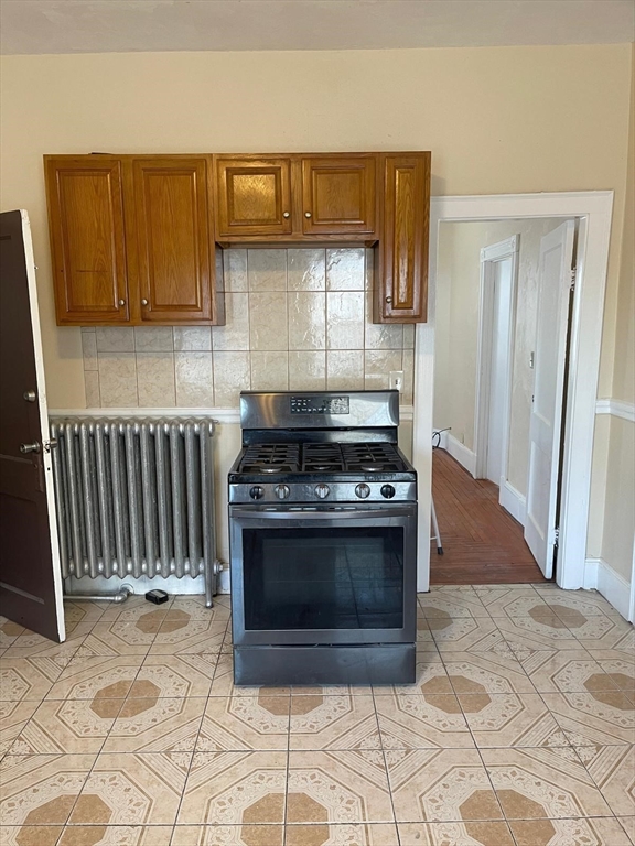 39 Magnolia Street, Unit 2 Malden, MA 02148 - Photo 4 of 15 a kitchen with a stove and a cabinets