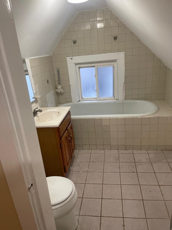 39 Magnolia Street, Unit 2 Malden, MA 02148 - Photo 9 of 15 a bathroom with a sink a toilet and mirror