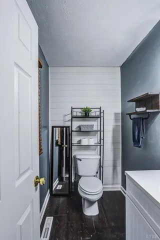 a bathroom with a toilet and a sink