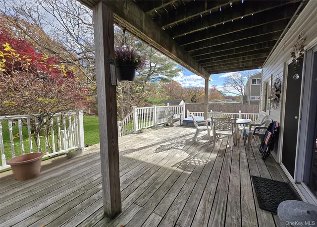 a view of a porch with wooden floor