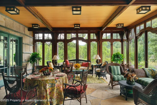 a very nice looking living room with a large window and furniture