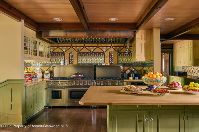 a kitchen with a stove and cabinets