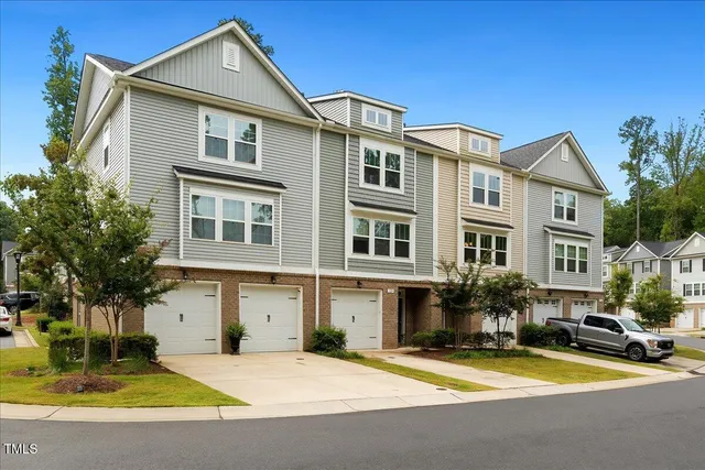a view of a house with pool and sitting area